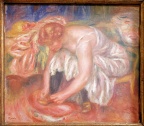 Femme laçant sa chaussure. Pierre Auguste Renoir.