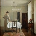 Carl Holsoe - La Femme de l'artiste dressant la table.